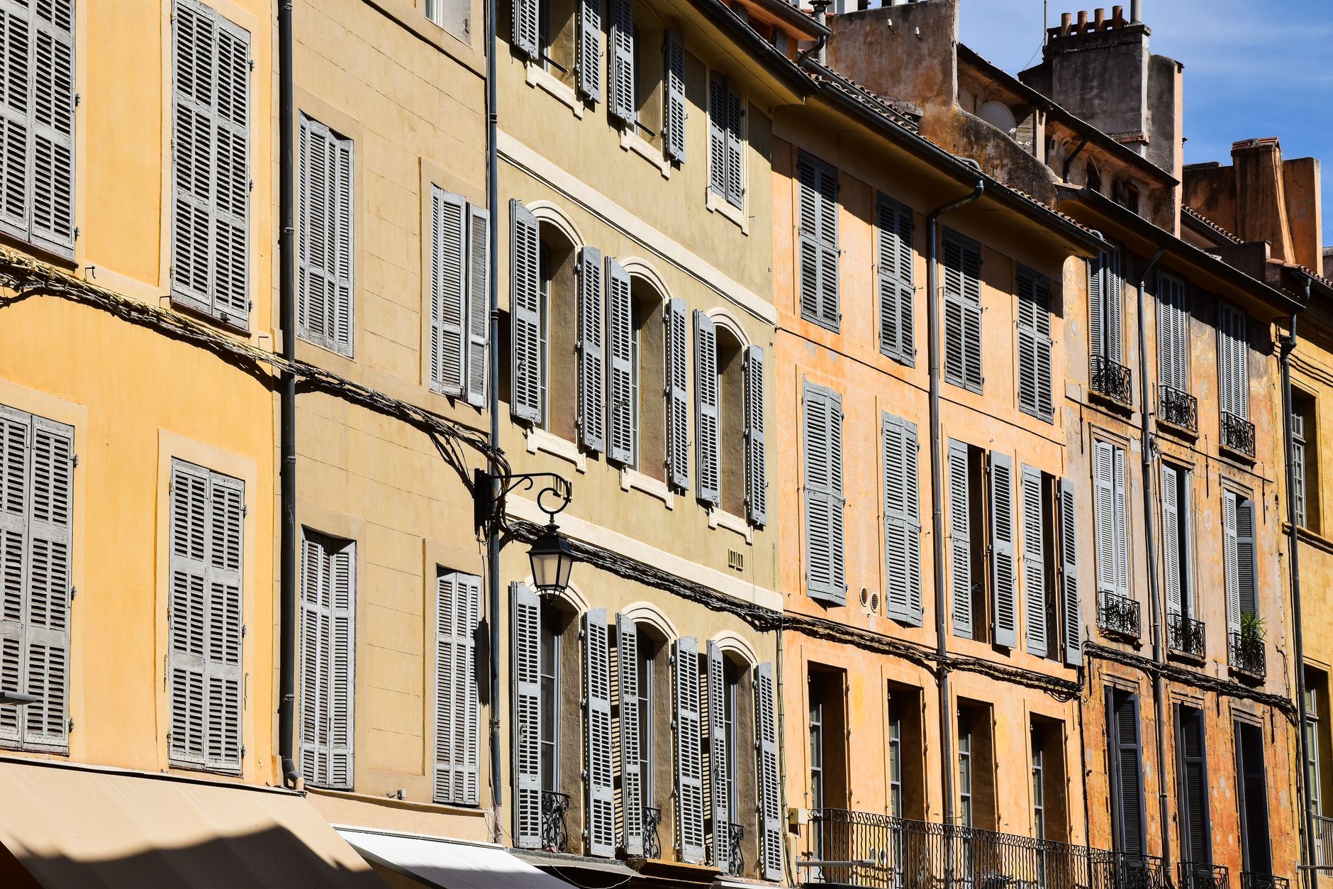 Elegant traditional buildings with shuttered windows in Aix-en-Provence, France. (Pexels, AXP Photography)
